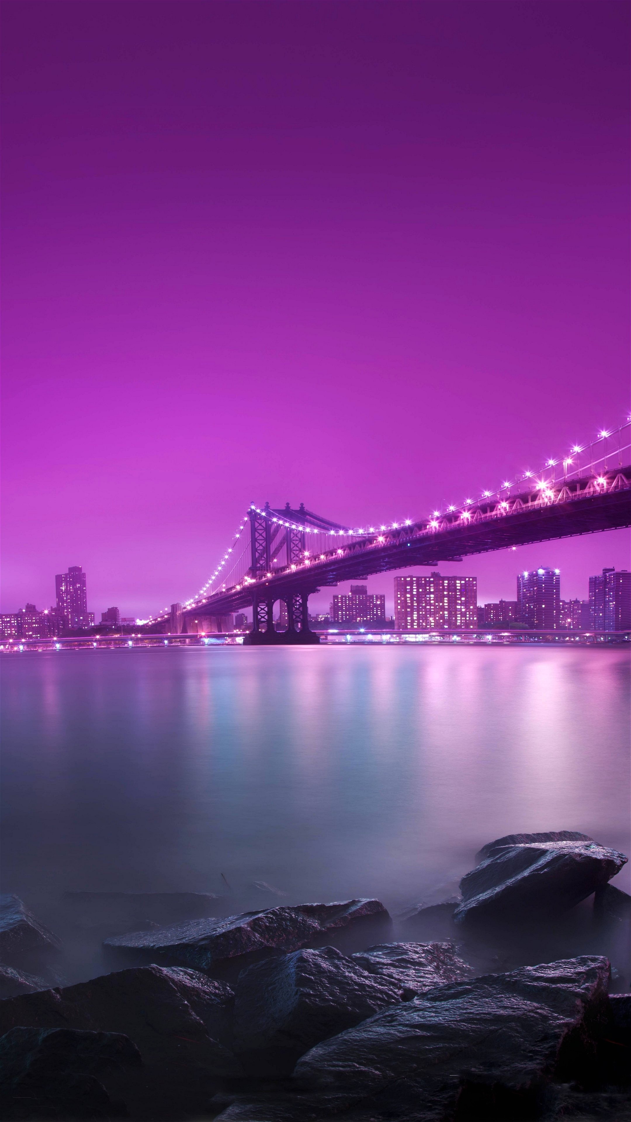 4K background image of a bridge at night with purple sky
