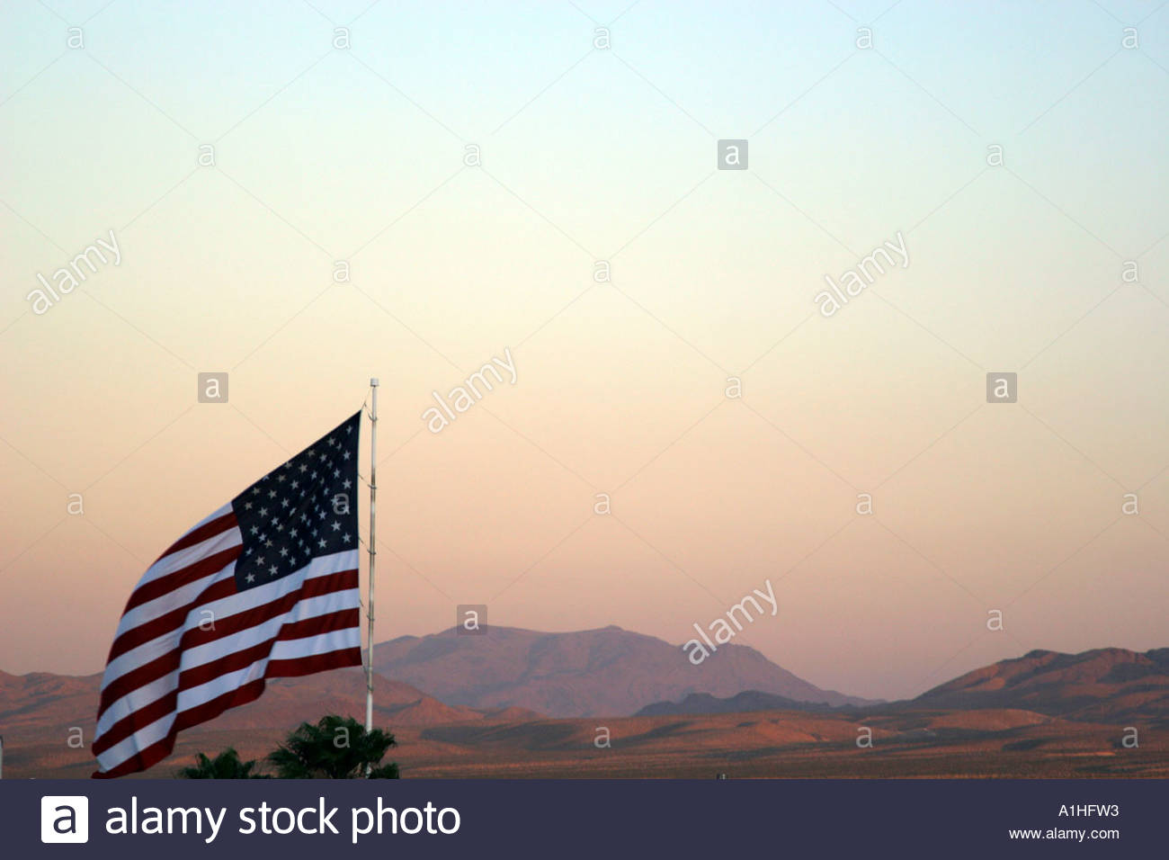 Stars And Stripes With Mojave Desert In Background Usa Stock Photo