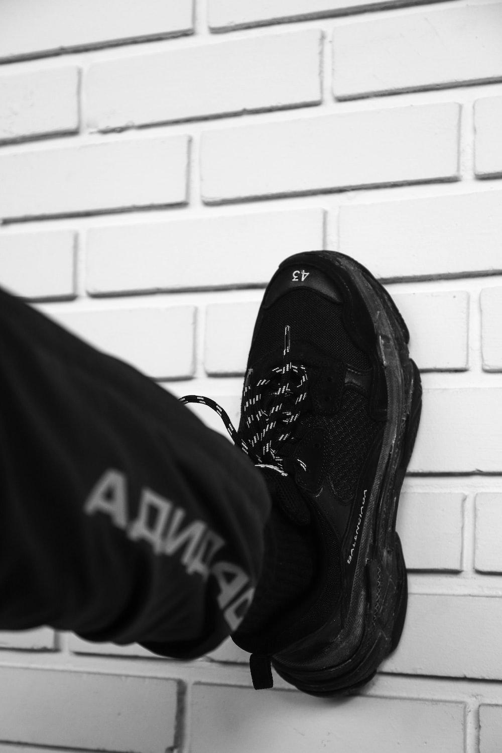 Person wearing black Nike Vapor Max shoe photo Free Fashion