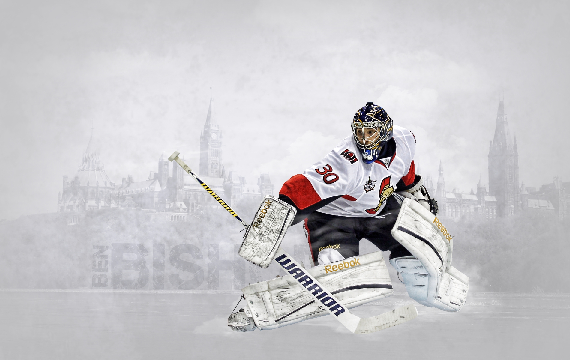 A hockey goalie in action, making a save against a blurred background of a city skyline. The goalie is wearing a white jersey with red and black accents, and is equipped with a helmet, gloves, and leg pads. The goalie is positioned in a dynamic pose, with his stick extended in front of him