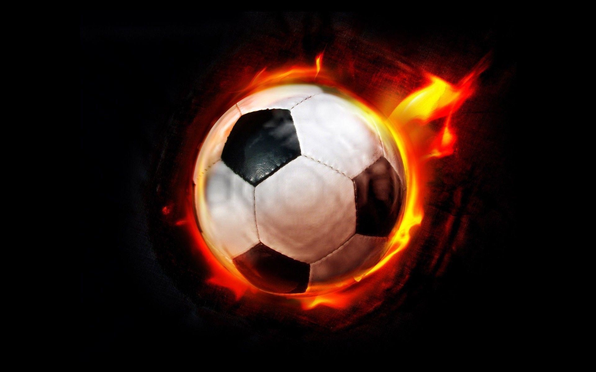 A soccer ball engulfed in flames against a black background, symbolizing the fiery passion and intensity of the sport