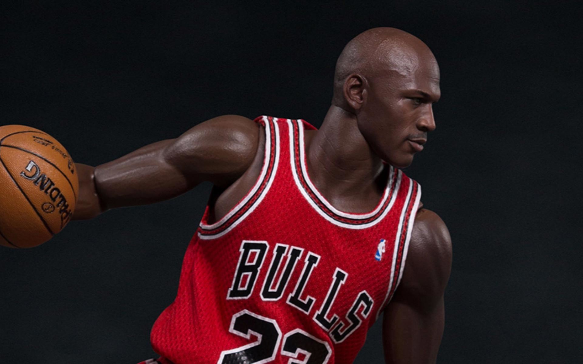 Michael Jordan in his Chicago Bulls uniform, dribbling a basketball