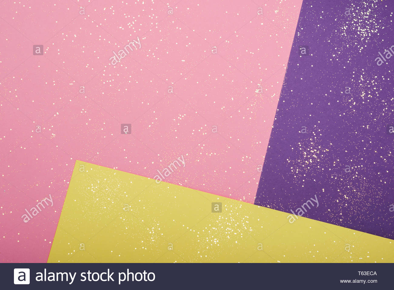 Golden Glitter Scattered On The Pink Purple Yellow Card Background