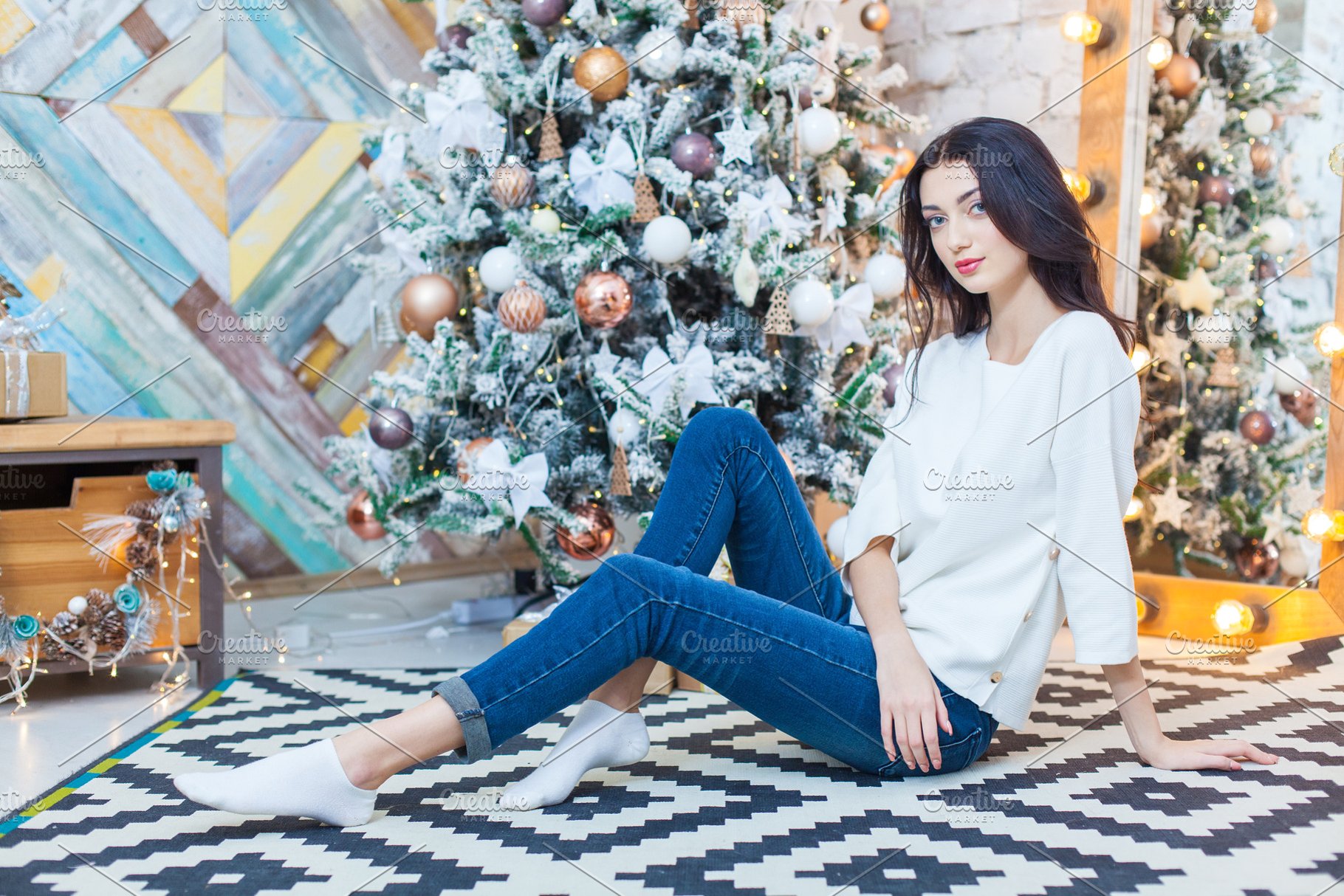 Christmas Beautiful Smiling Girl Is Sitting Over Tree