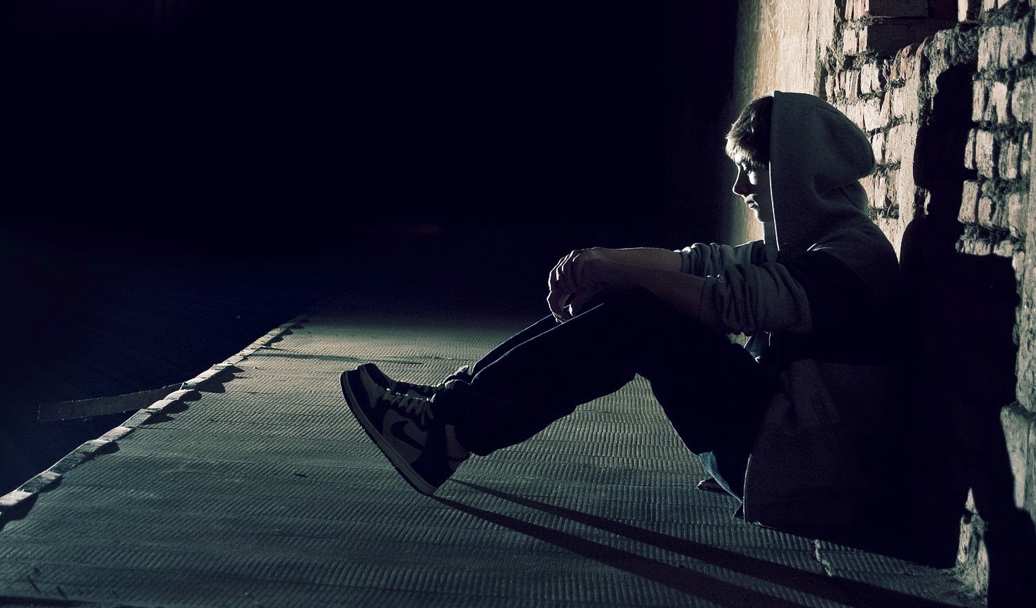 Sad Boy Sitting Alone Wallpaper