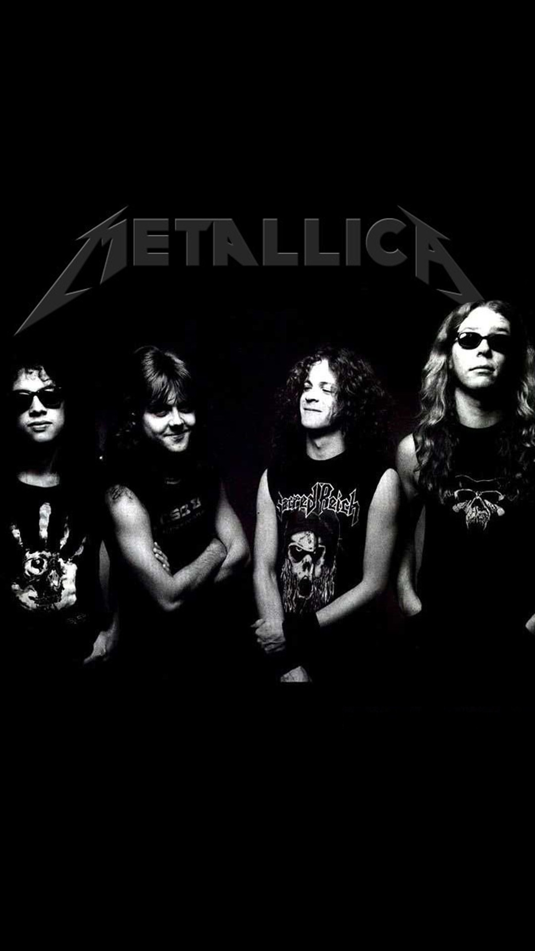 Black and white photo of the band Metallica, featuring James Hetfield, Lars Ulrich, Cliff Burton, and Kirk Hammett