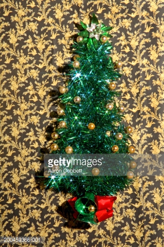 Vintage Tinsel Tree Ornament On Wallpaper Stock Photo Getty Image