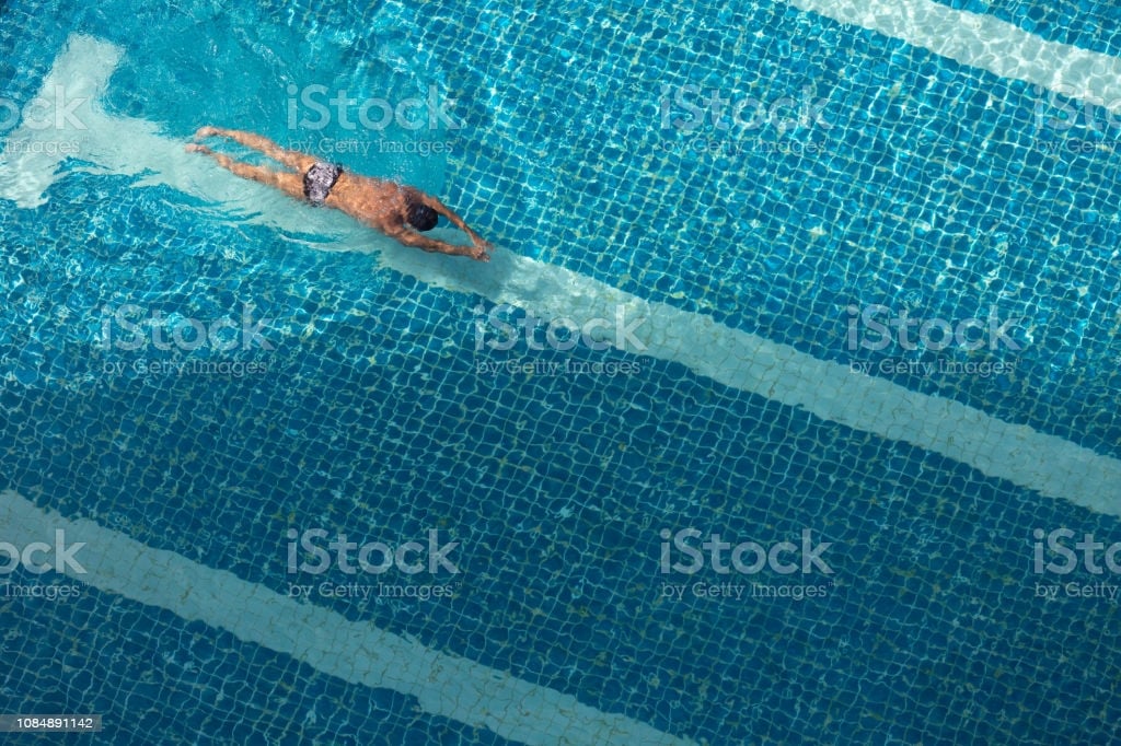 Swimmers Action Backgrounds A Male Swimmer Swims Alone In A Blue 1024x682