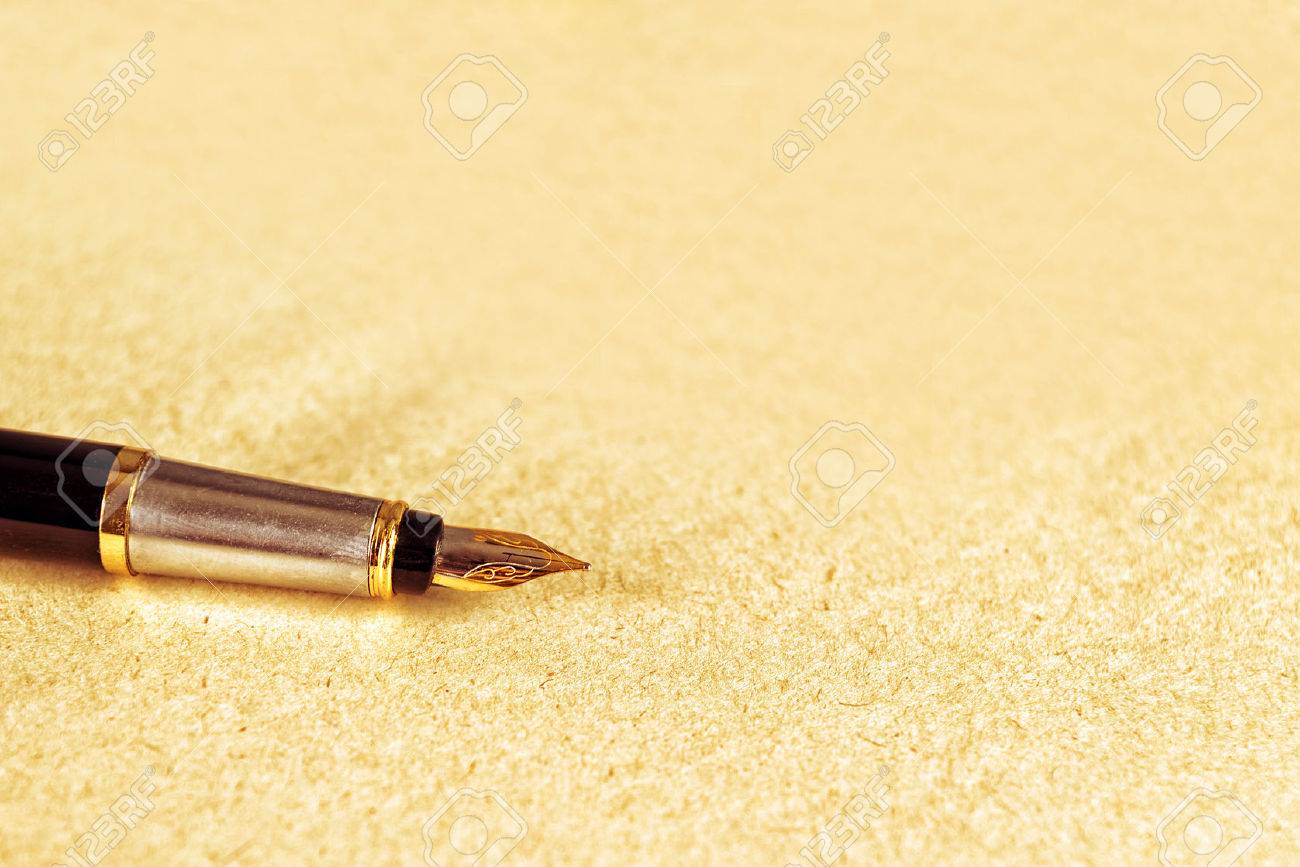 Vintage Fountain Pen On Old Yellow Paper Textured Background Stock