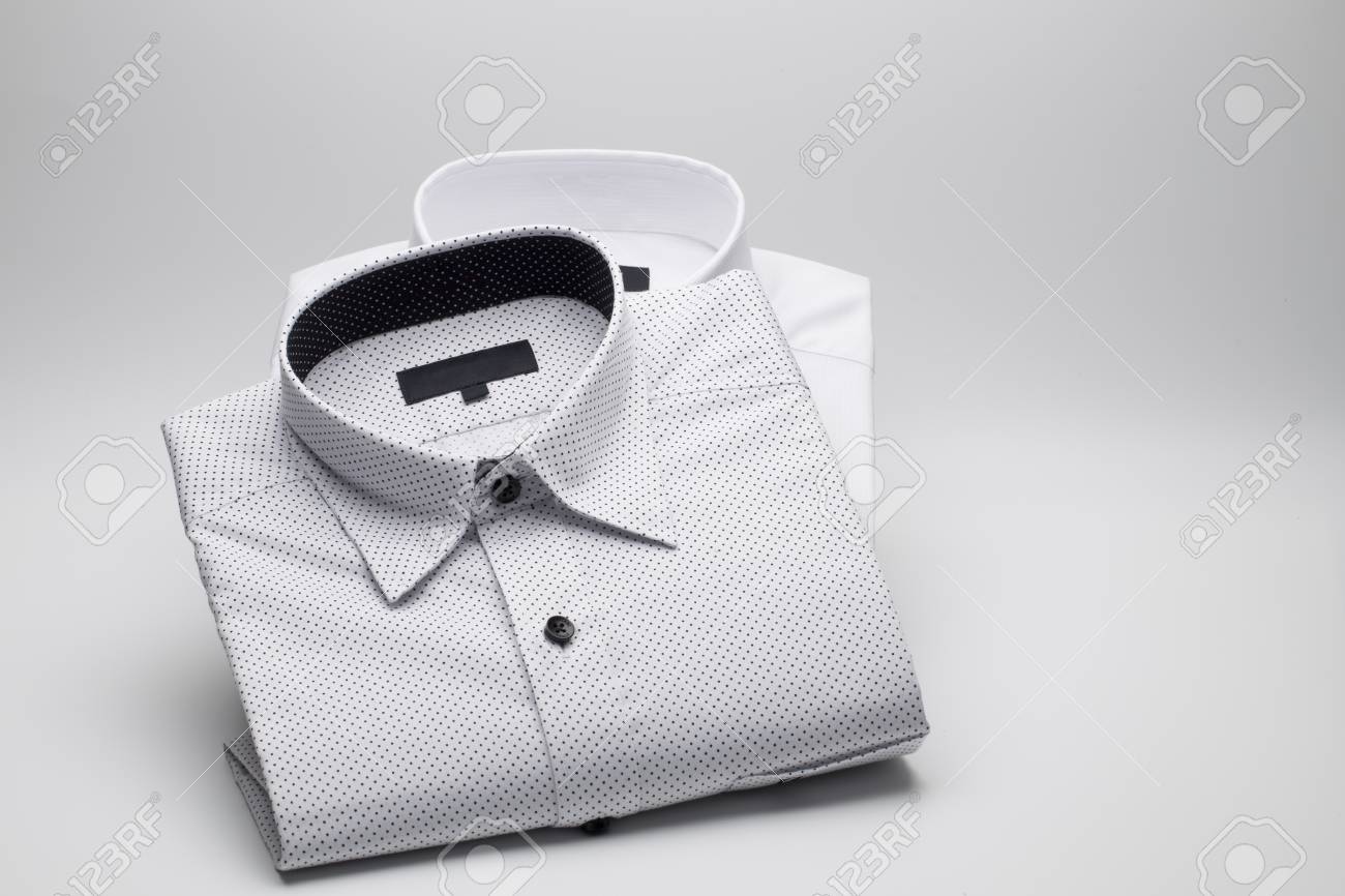Men S Shirts Folded On A White Background Stock Photo Picture And