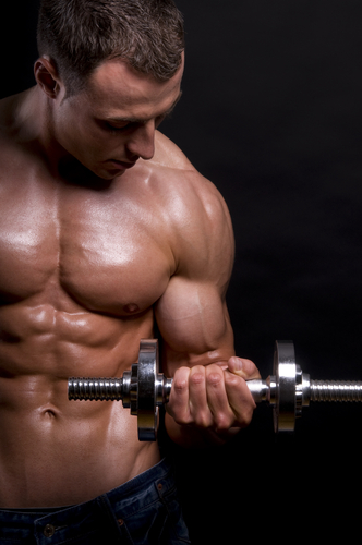 Muscular Man With Dumbbells On Black Background