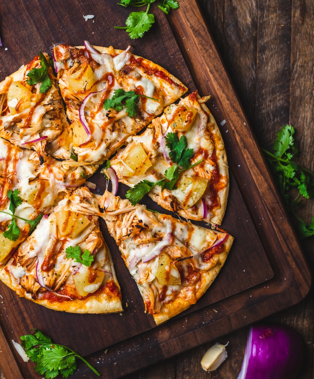 pizza on chopping board photo Free Pizza Image on