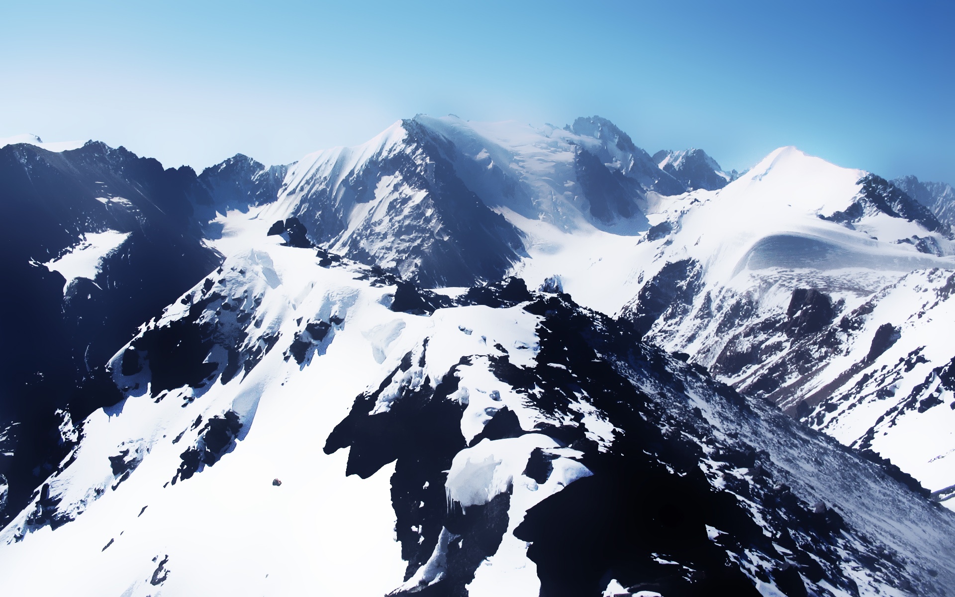 Snow Covered Mountains Over Desktop Wallpaper
