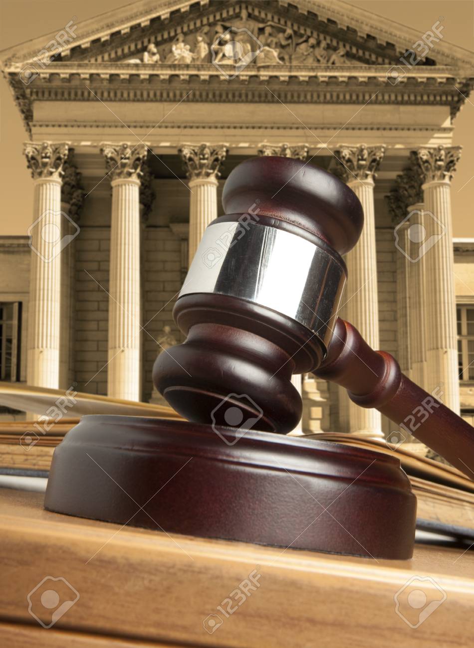 Gavel Against The Background Of Courthouse Stock Photo