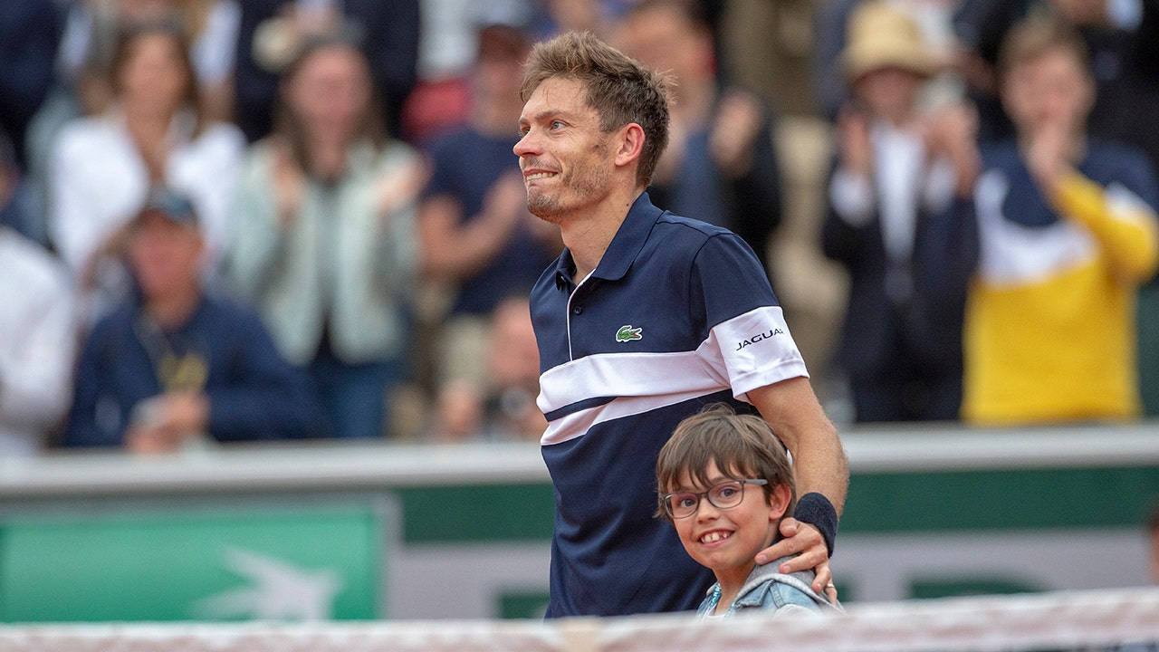 Tennis Legend Nicolas Mahut Celebrates Victory With His Son Wallpaper