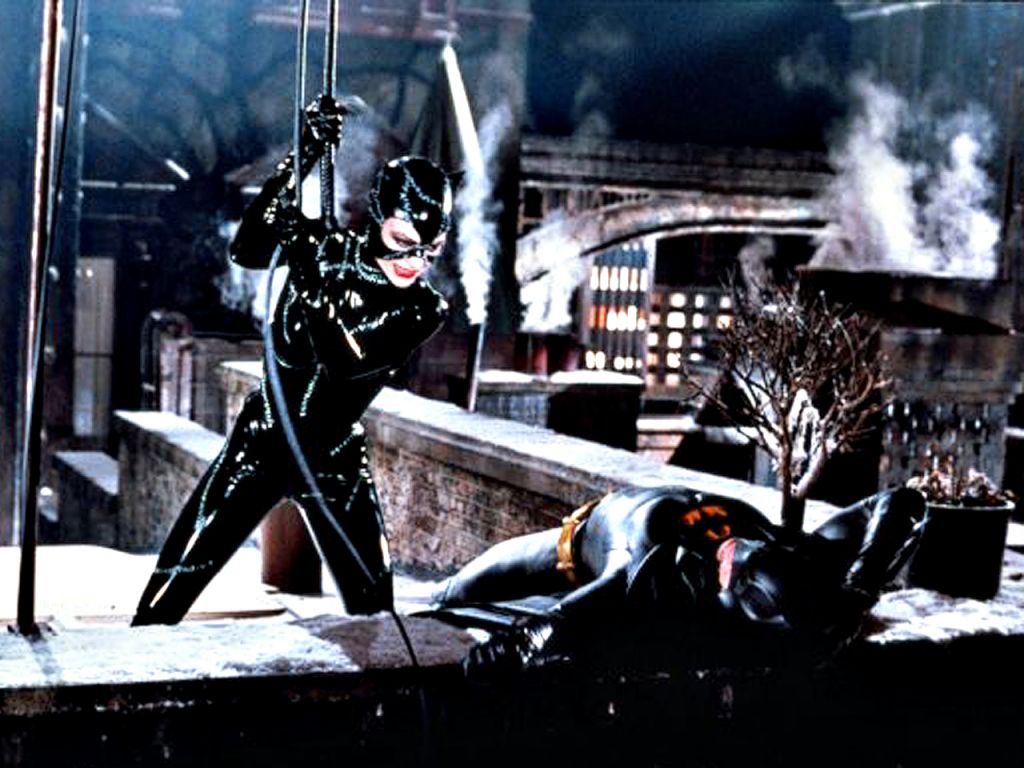Catwoman Fights Batman On Roof Wallpaper