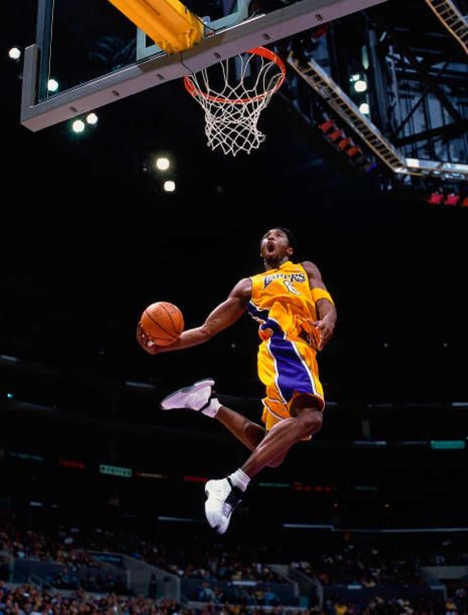 Kobe Bryant Taking Flight On The Hardwood Wallpaper