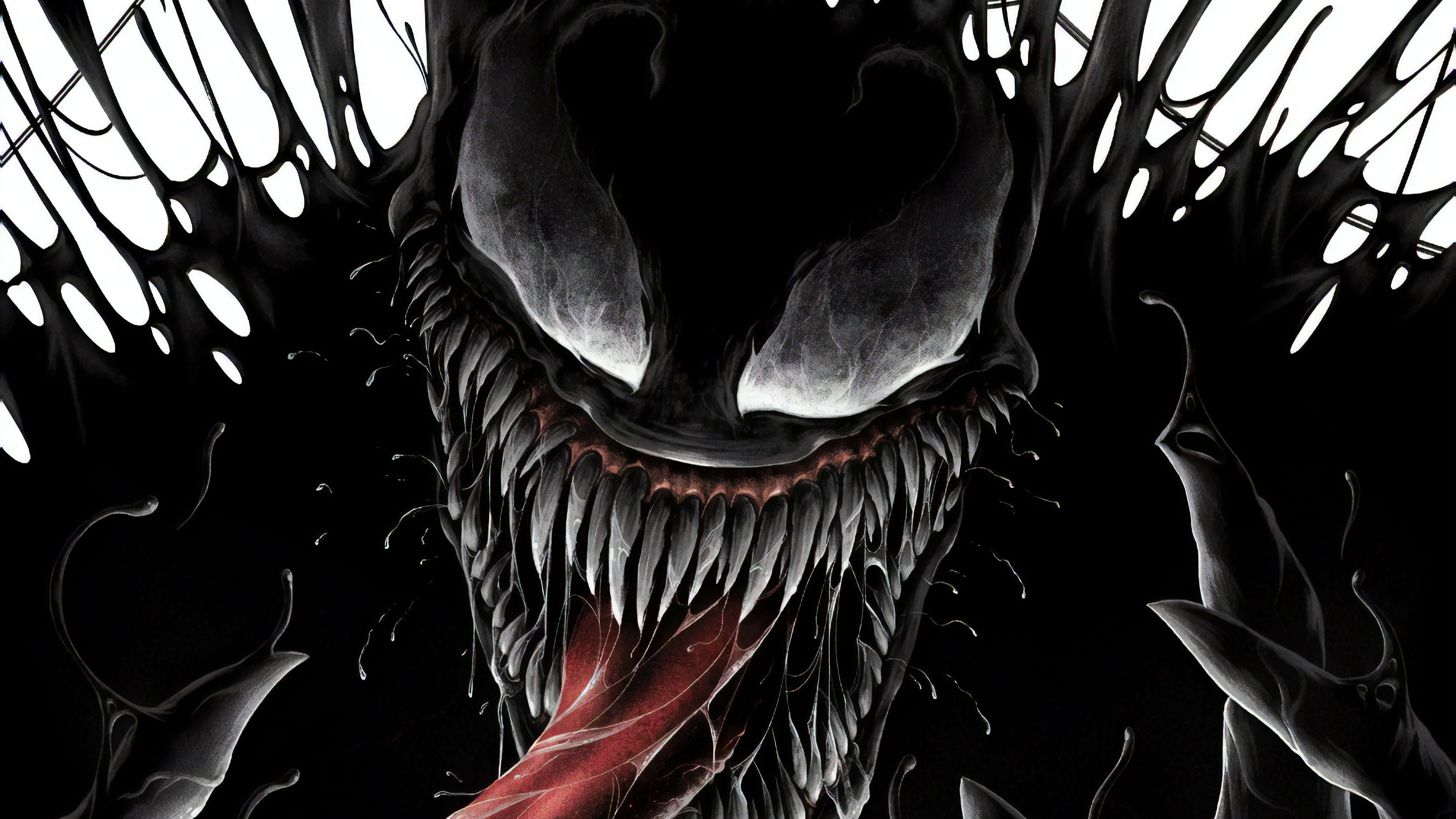 Close-up of Venom's menacing face with sharp teeth and long tongue, surrounded by symbiotic tendrils, against a white background
