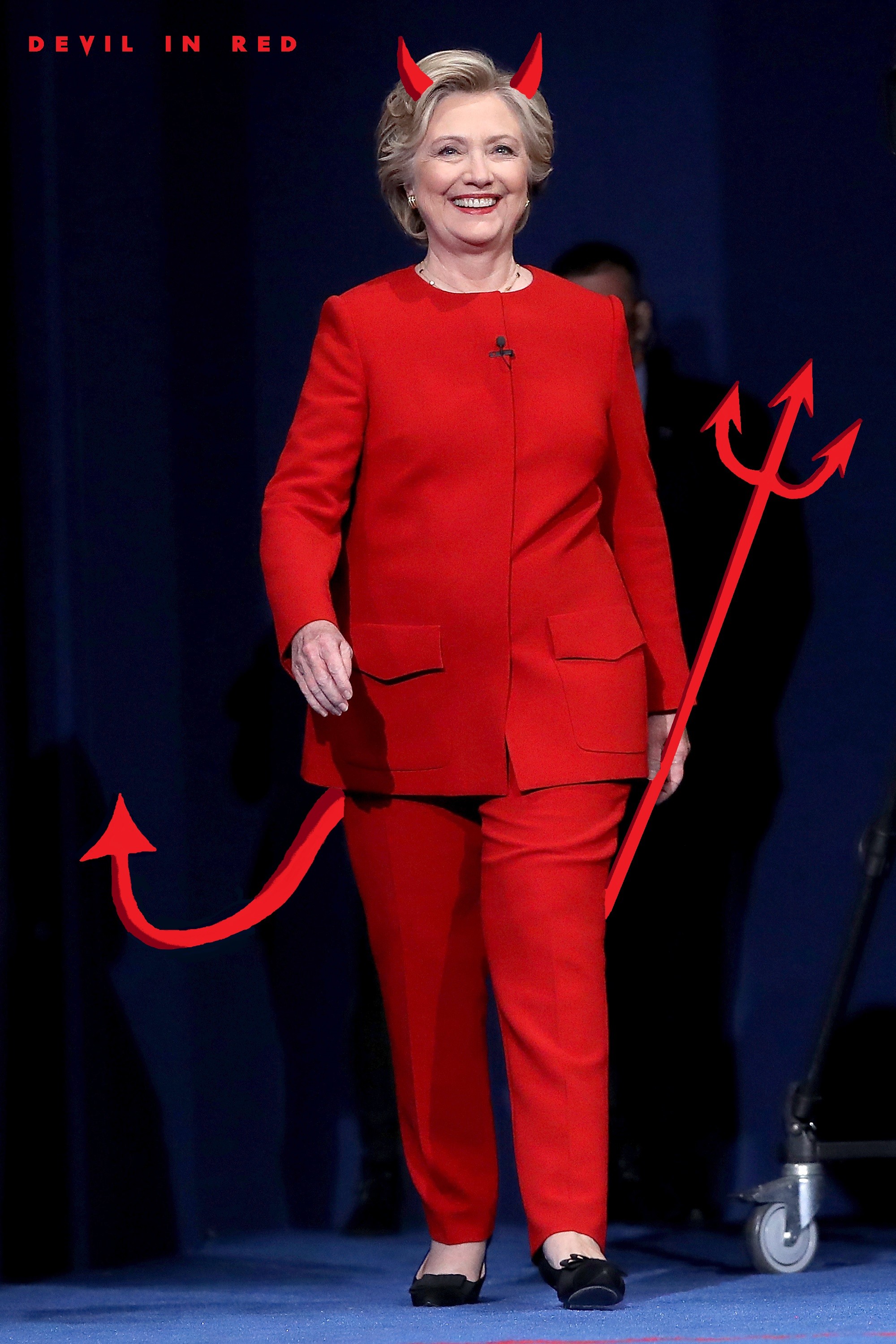 Hillary Clinton in a red suit with devil horns and a trident, edited image