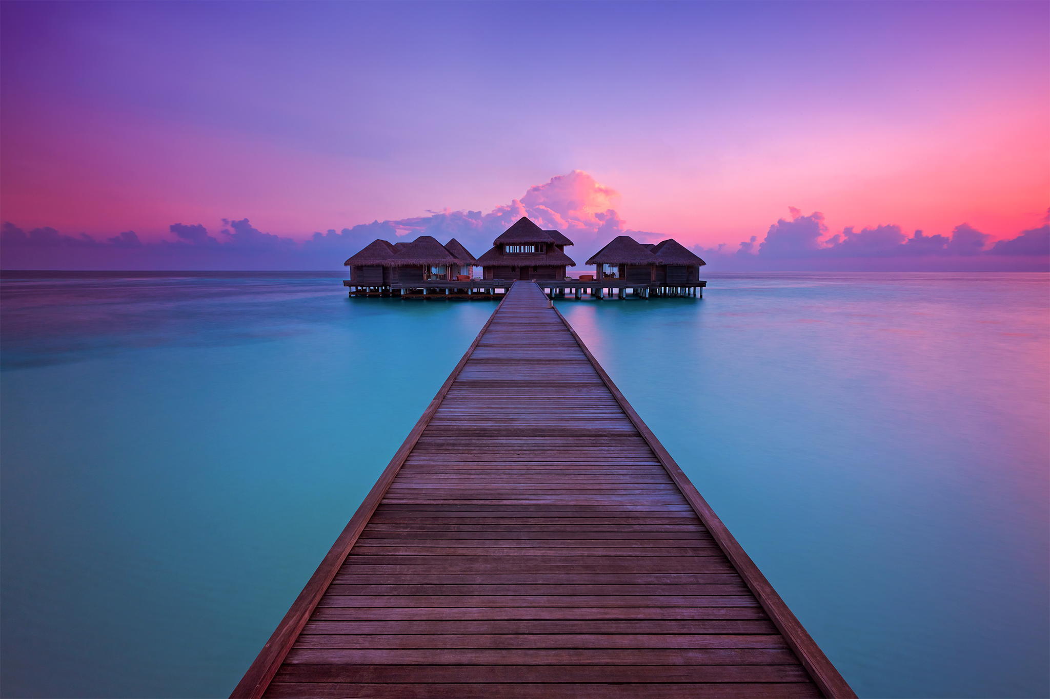 Maldives resort ocean pier bungalows sunset huvafen fushi per