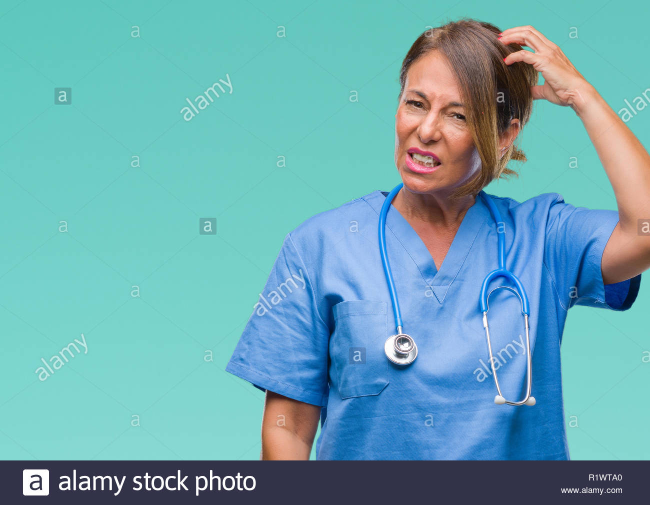 Middle Age Senior Nurse Doctor Woman Over Isolated Background