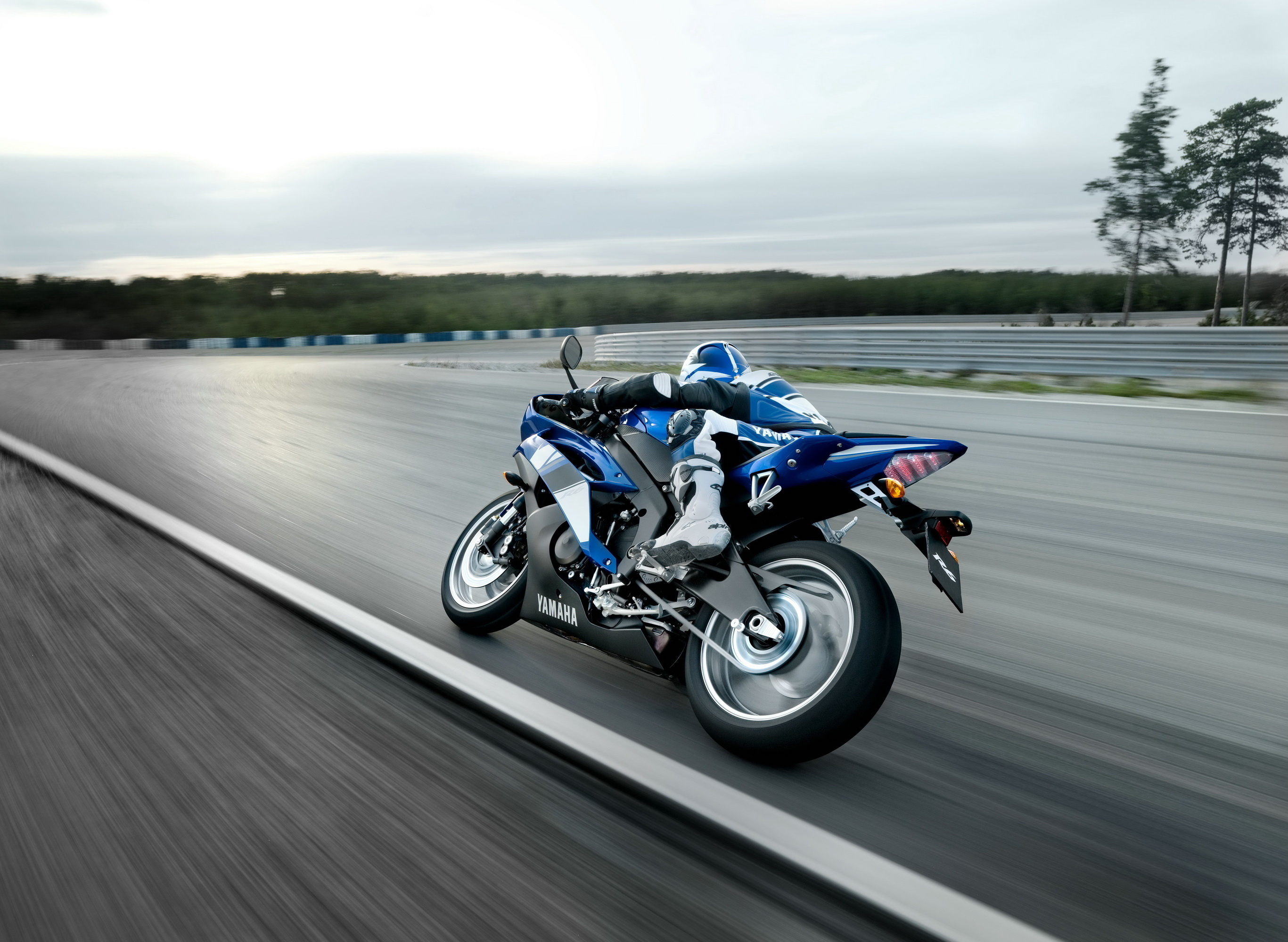 Yamaha R1 sportbike speeding on a racetrack