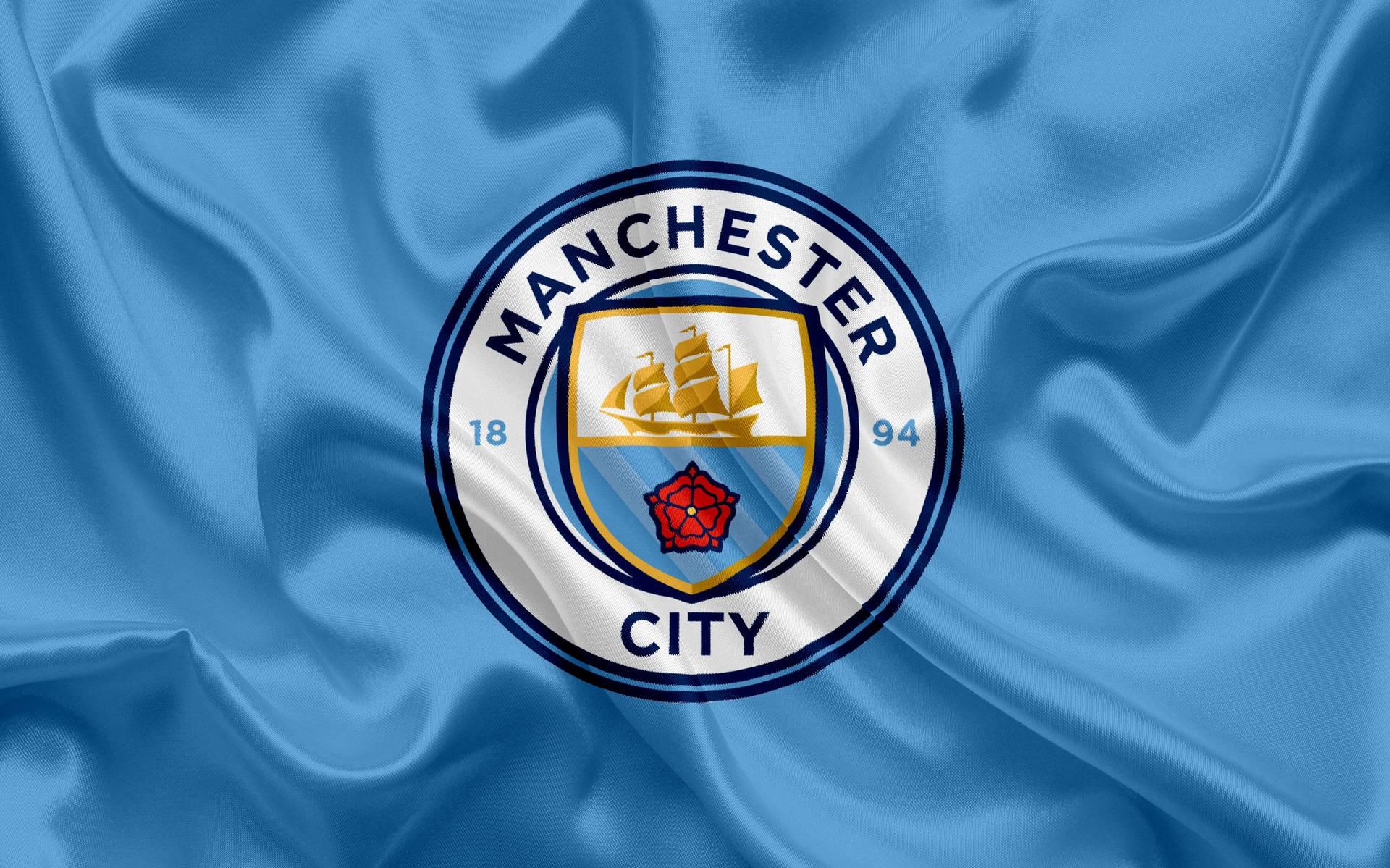 Download Manchester City Logo Blue Flag Wallpaper