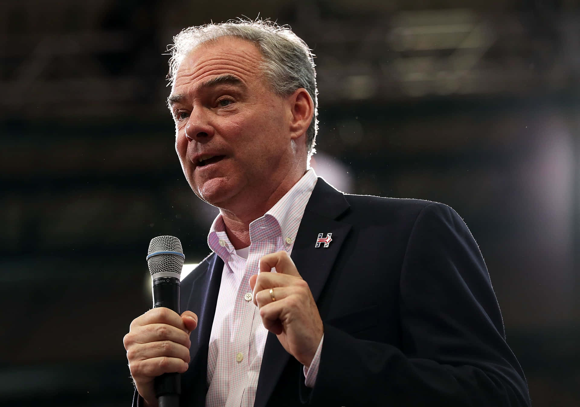 Tim Kaine Holding A Microphone Wallpaper
