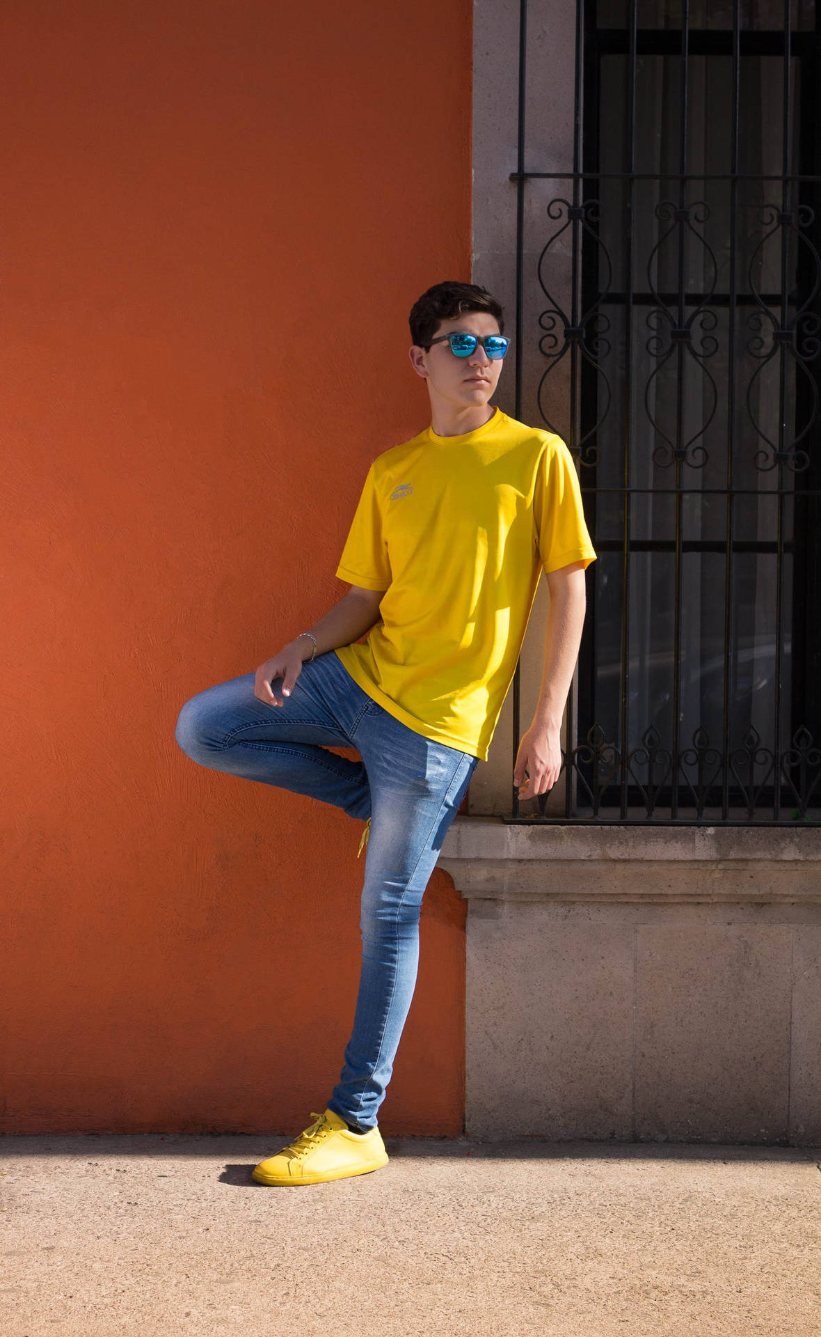 Handsome Boy In Streetwear Outfit Wallpaper