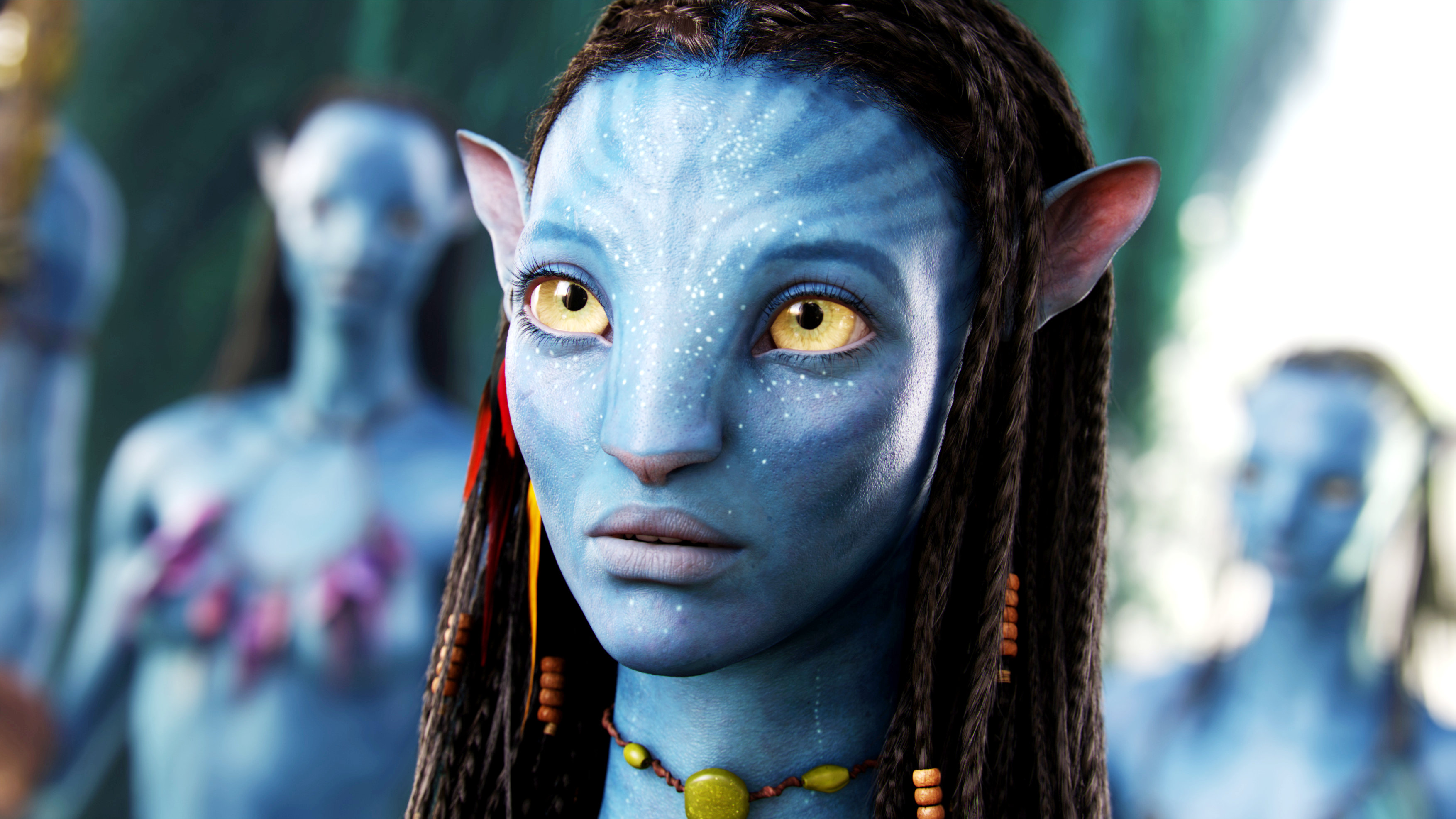 Neytiri, a Na'vi character from the movie Avatar, with striking yellow eyes and blue skin