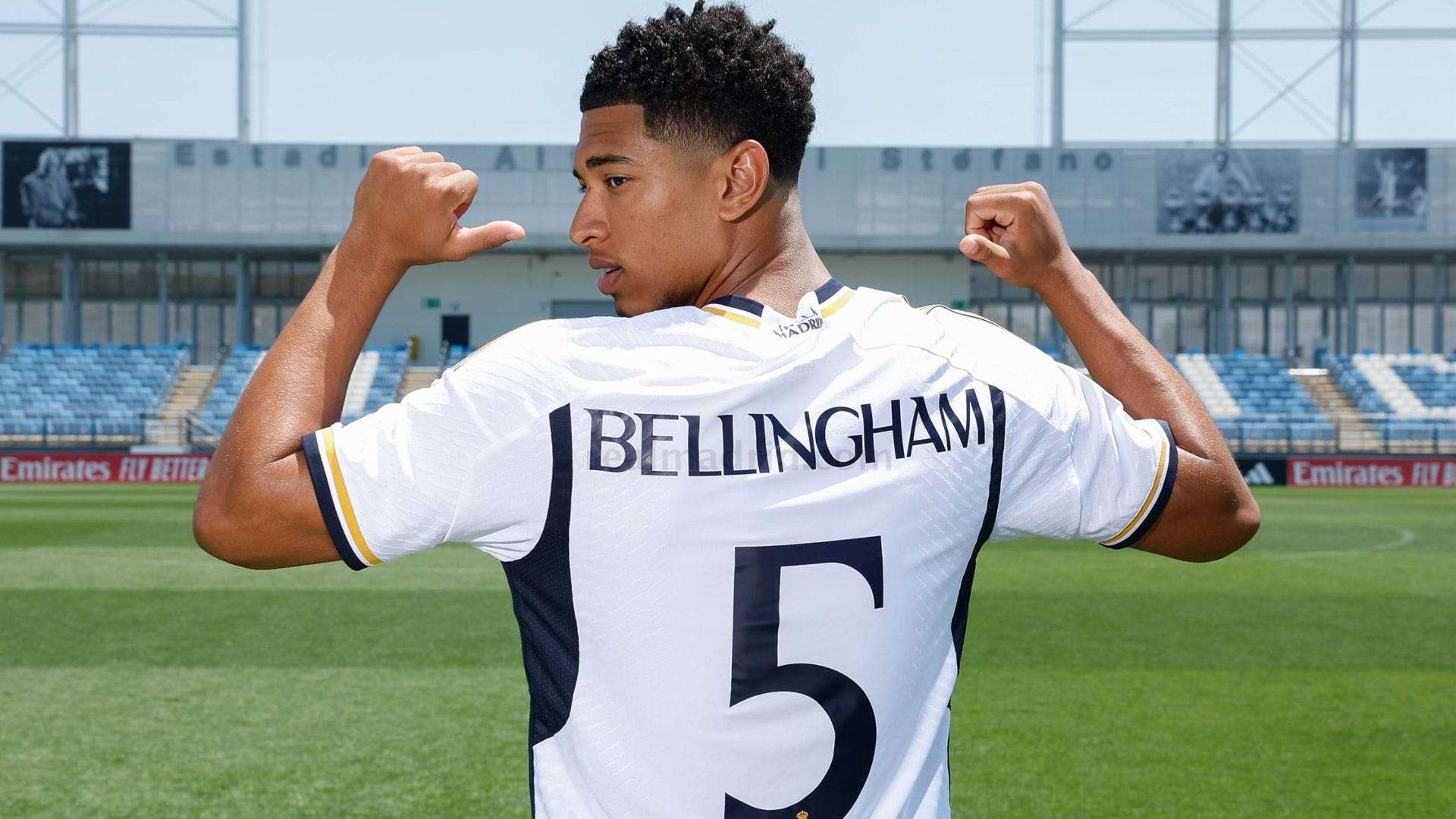 Jude Bellingham posing in his Real Madrid jersey at the Estadio Alfredo Di Stéfano