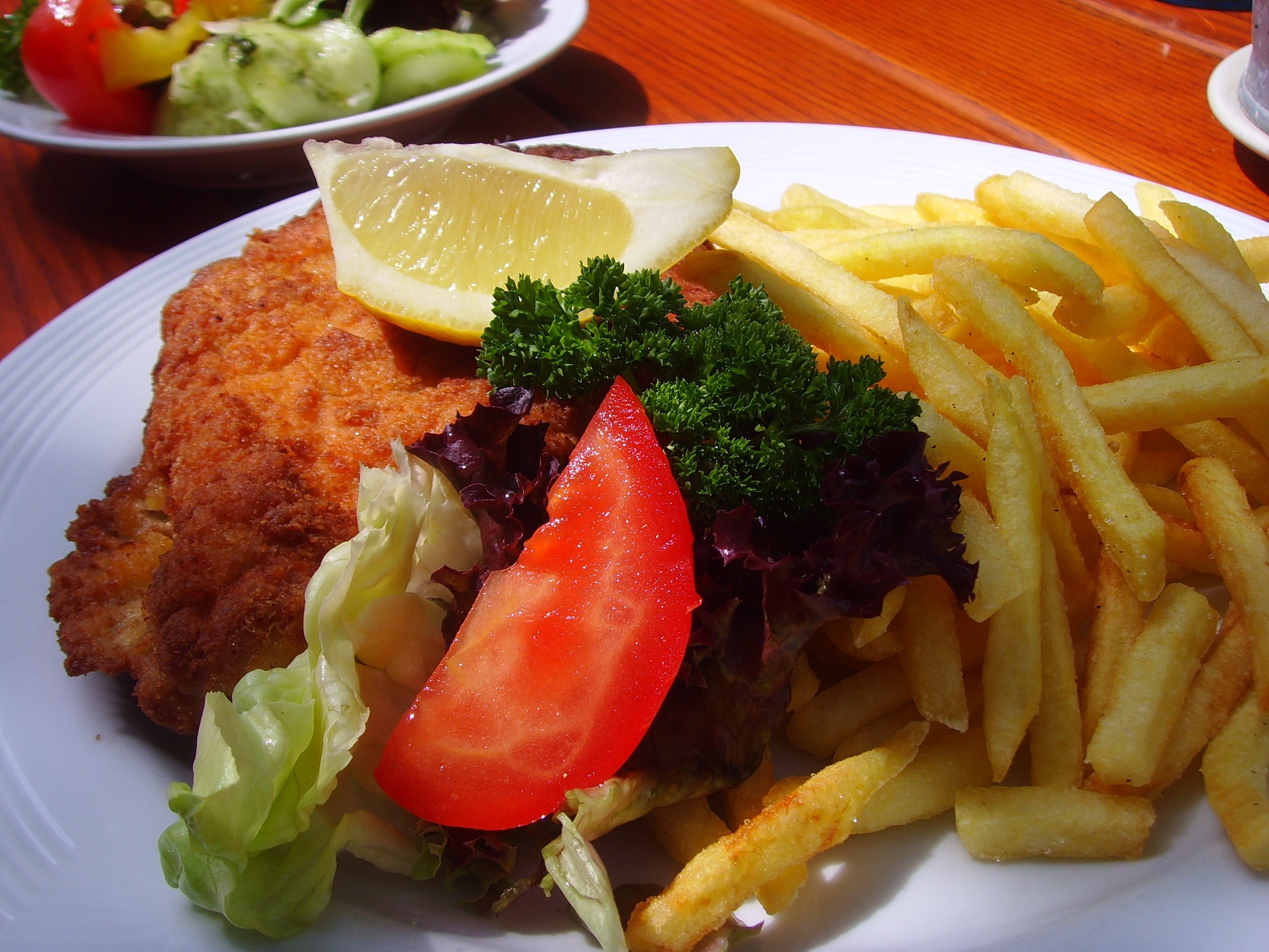 Brown Dish With Fries And Vegetable Image