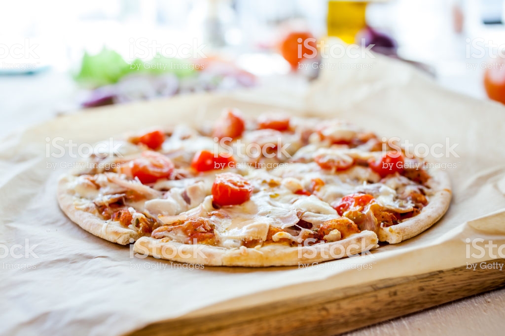 Hot Fresh Homemade Traditional Italian Pizza On Wooden Table