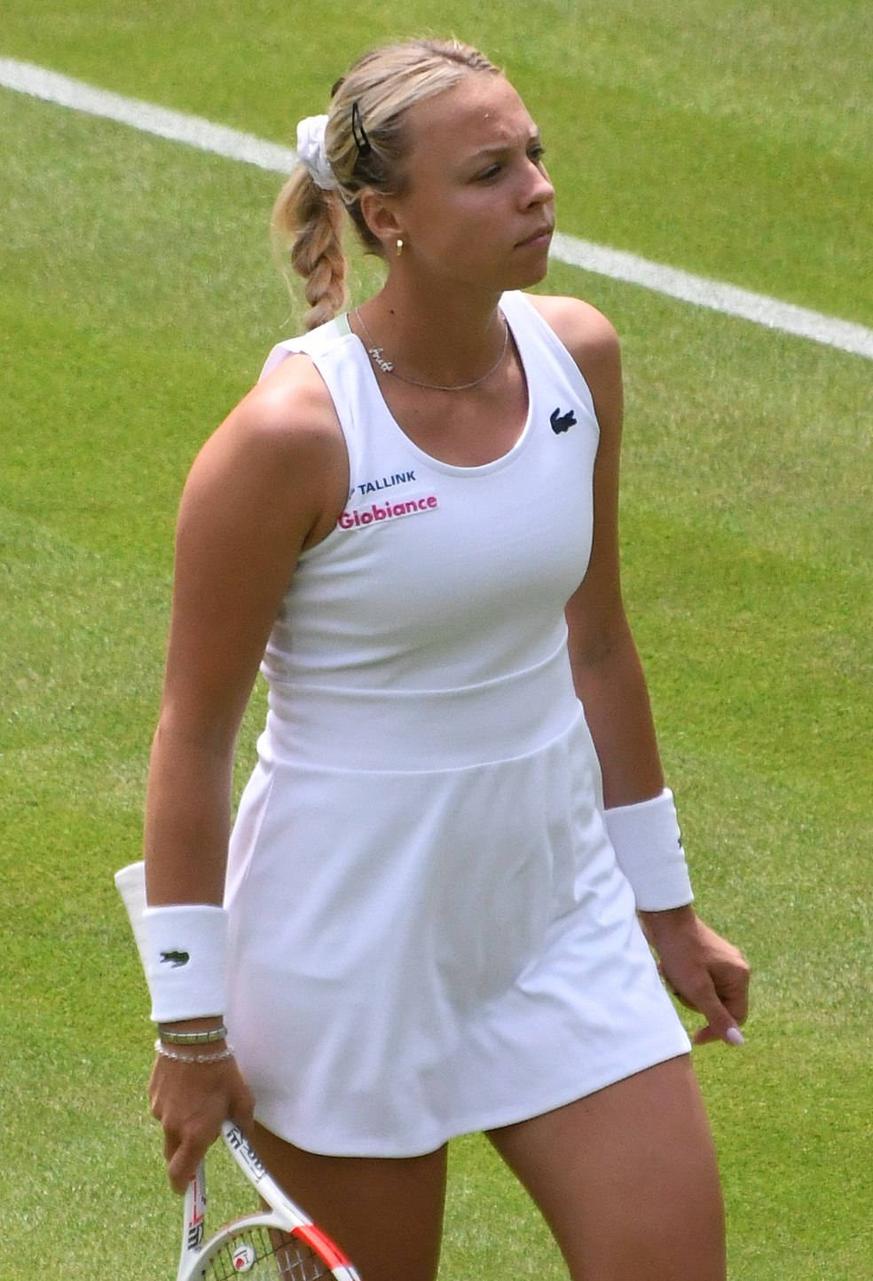 Anett Kontaveit In White Grassy Court Wallpaper