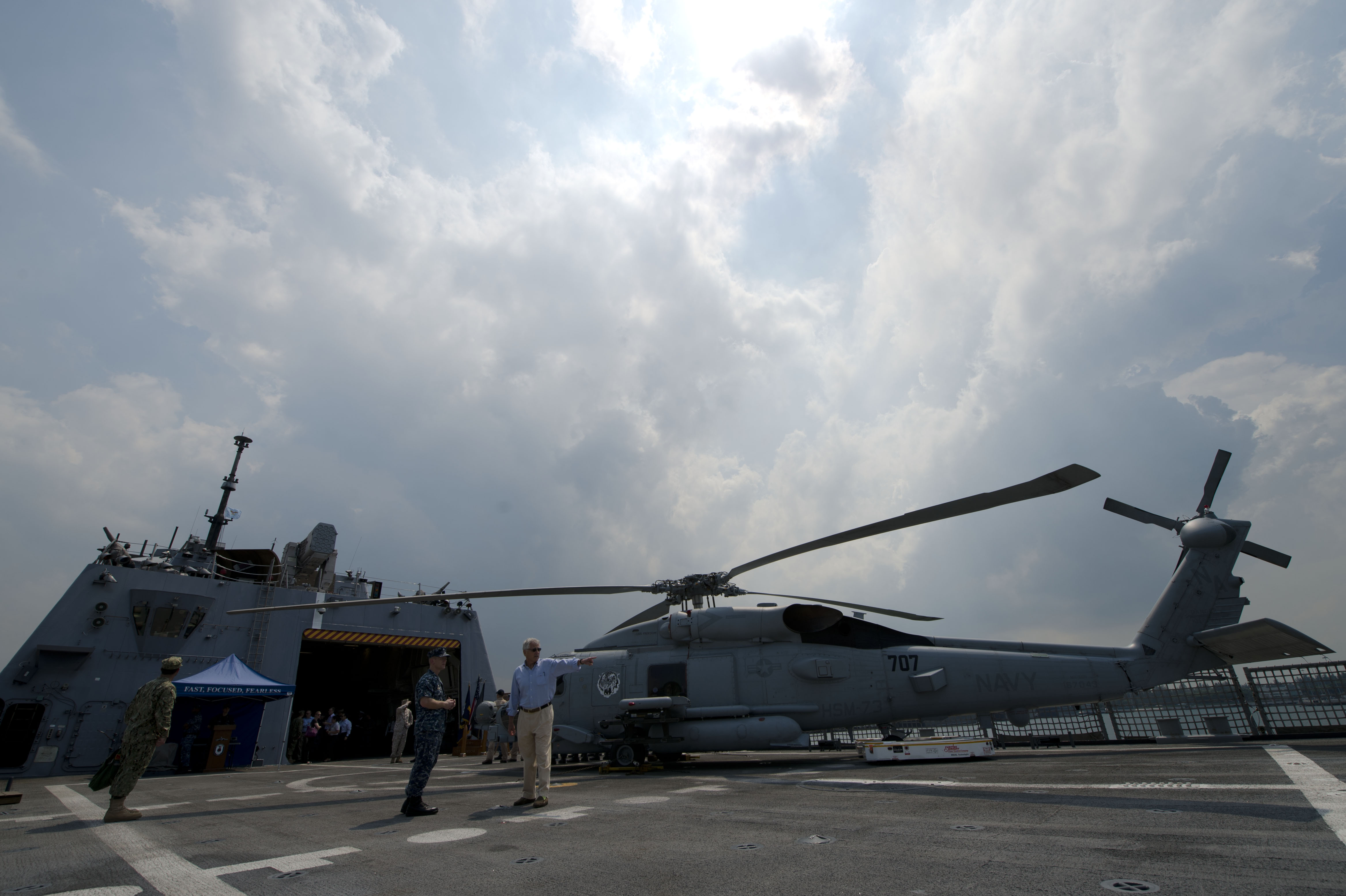 Defense Chuck Hagel right tours the flight deck of the USS Freedom
