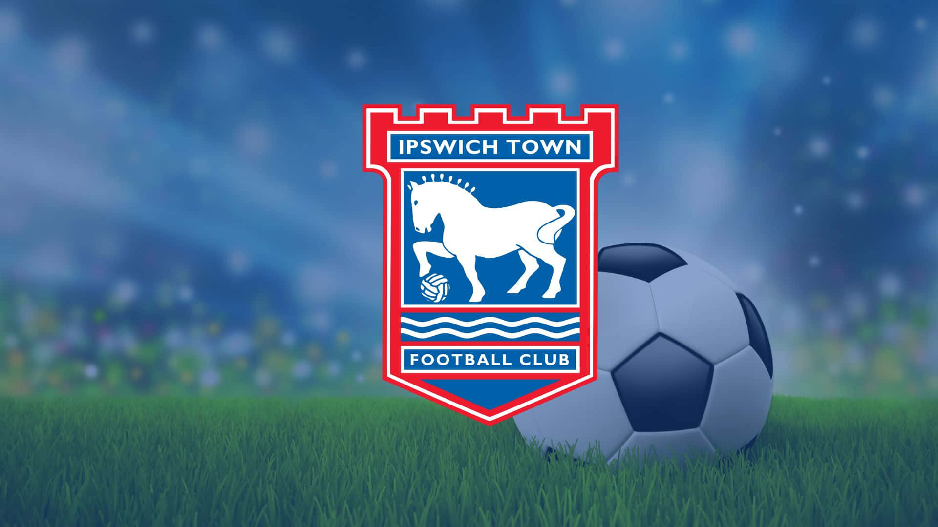 Ipswich Town Football Club Celebrating Victory On The Pitch Wallpaper