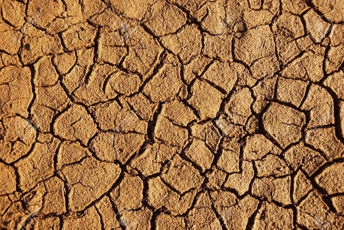 Dry Weathered Desert Soil Background With Pattern Of Cracks Stock