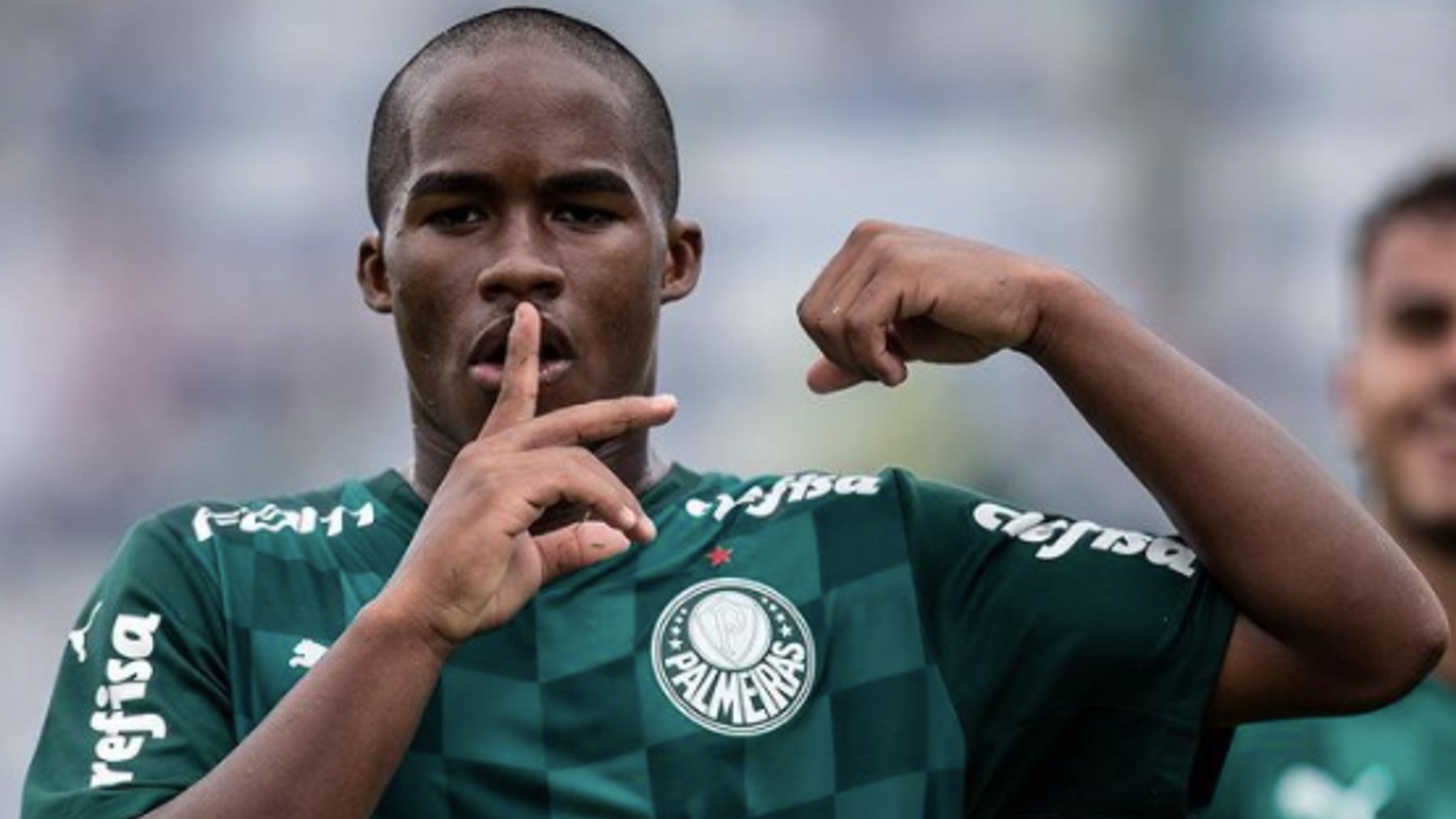 Endrick Felipe celebrates a goal for Palmeiras, with his finger to his lips in a 'shush' gesture