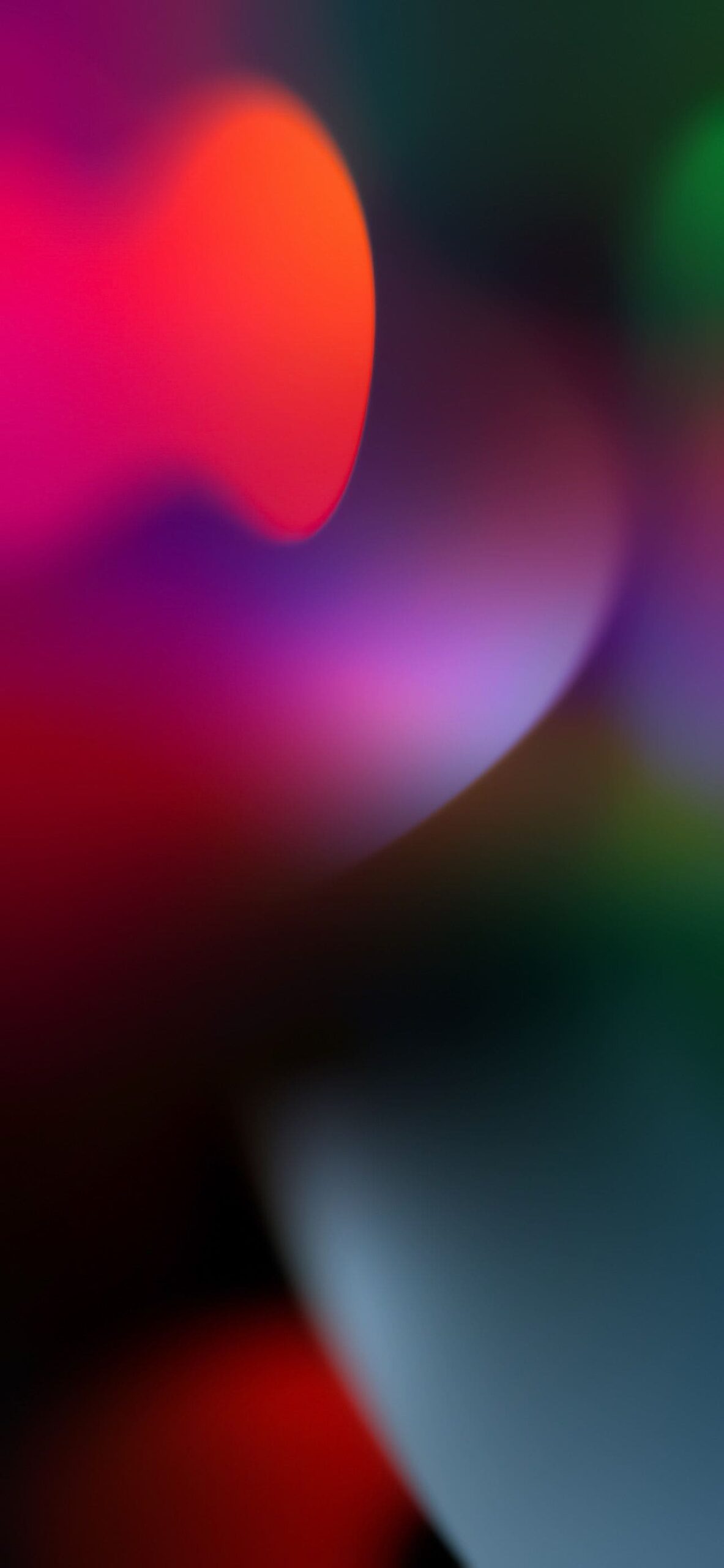 Abstract blurred background with red, purple, and green hues, suitable for an iPhone 14 Pro Max wallpaper