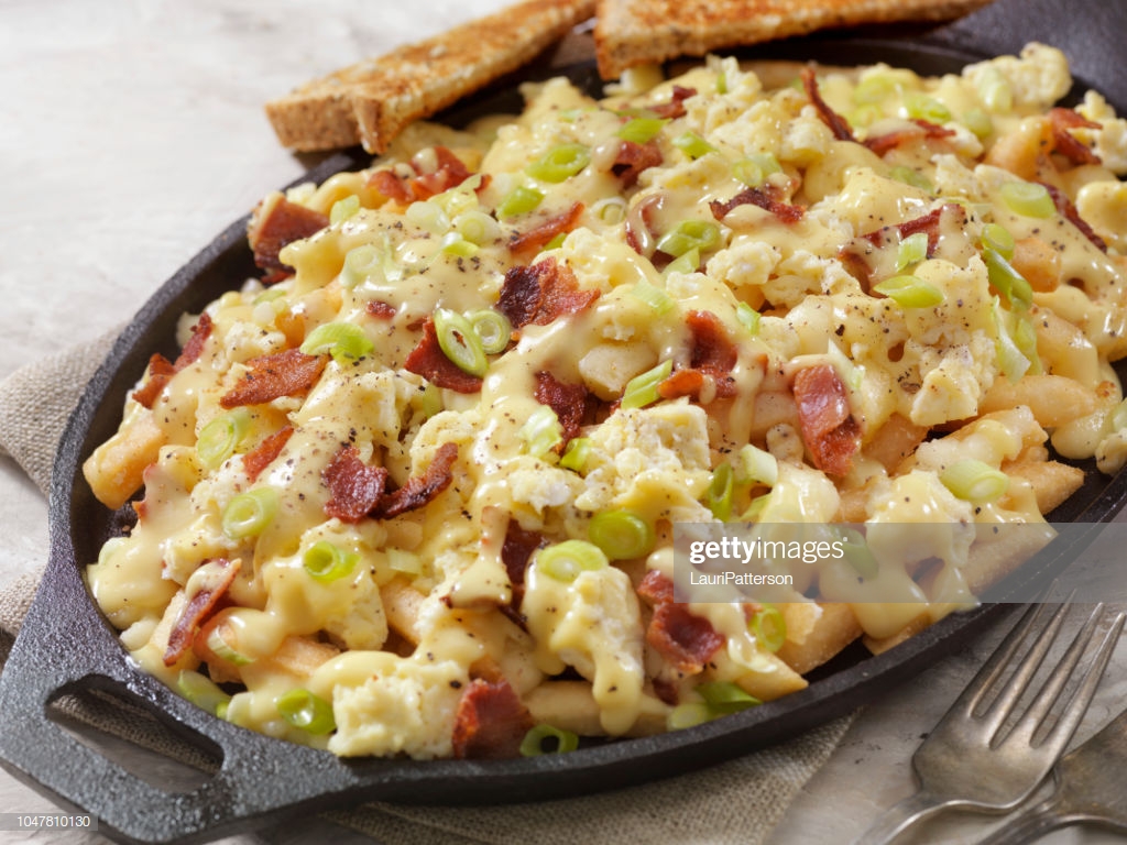 Breakfast Poutine With Hollandaise Sauce Scrambled Eggs Bacon And