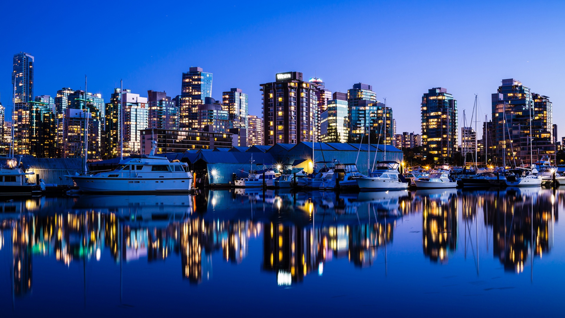 Vancouver Canada city night lights buildings sea yacht reflection