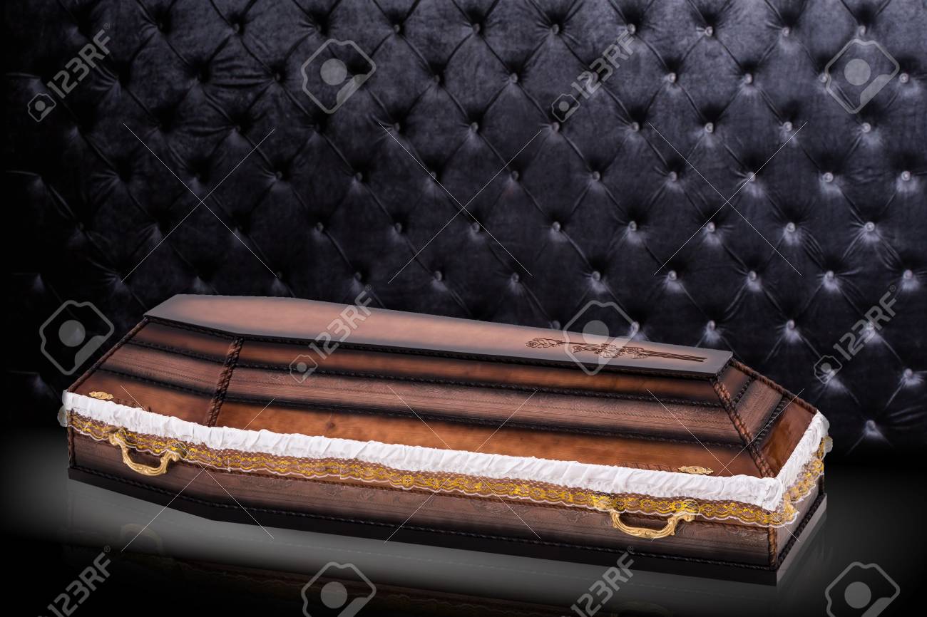 Closed Wooden Brown Coffin Covered With Cloth Isolated On Gray