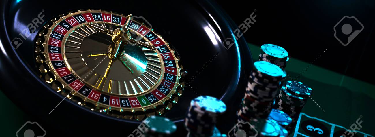 Casino Background Poker Chips On Gaming Table Roulette Wheel