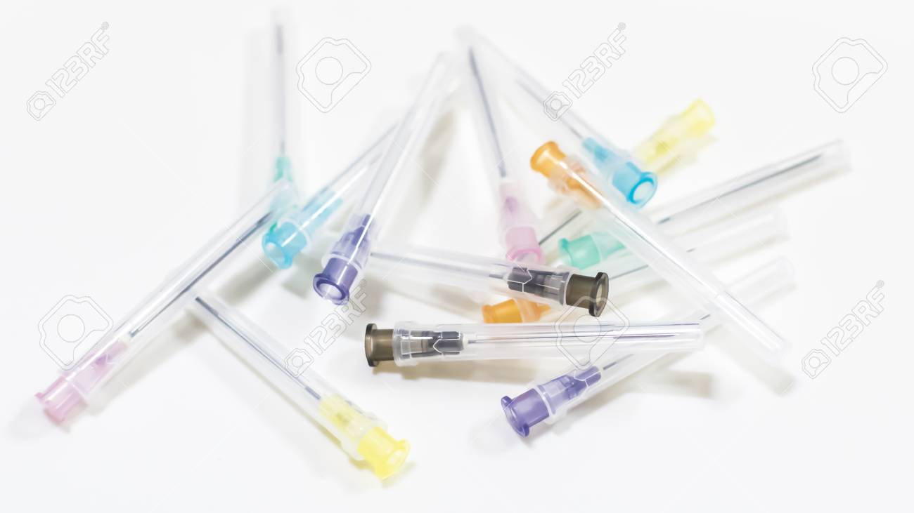 Colorful Needles Put In Needle Sheath On White Background Stock