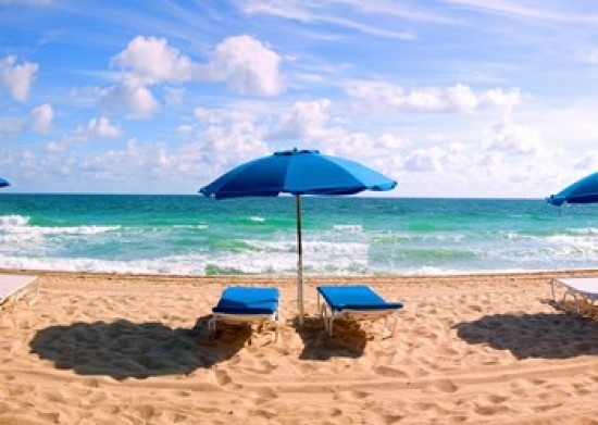 Lounge Chairs And Beach Umbrella On The Fort Lauderdale
