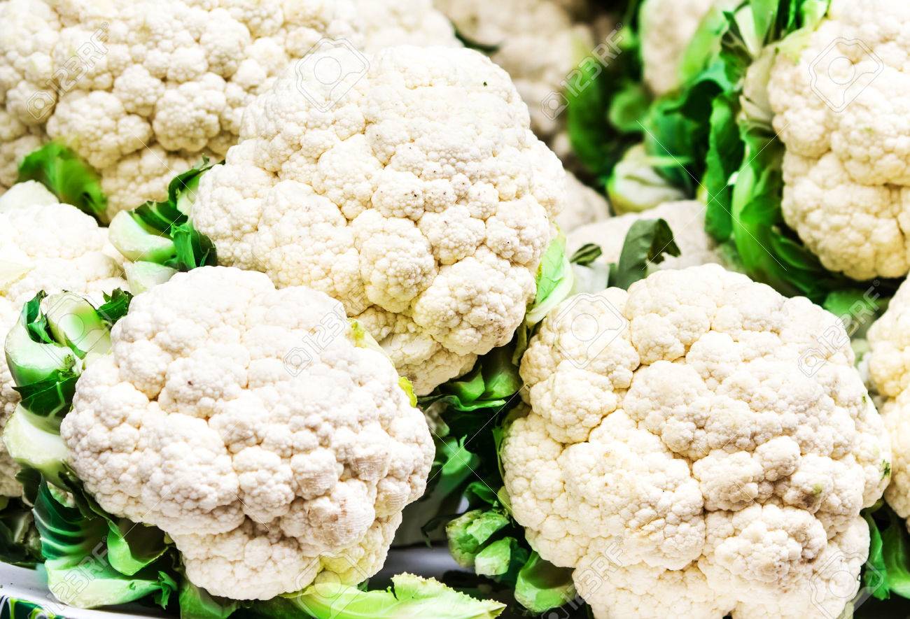 Fresh Raw Cauliflower On Market Close Up Background