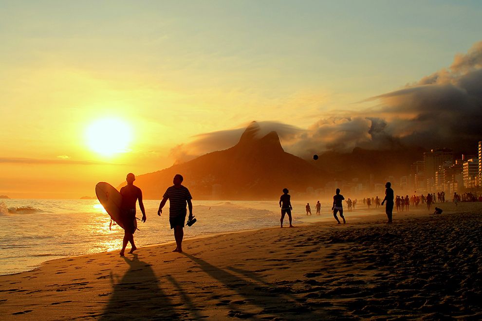 Surfers And Beachgoers At Sunset Along Ipanema Beach Rio De Janeiro