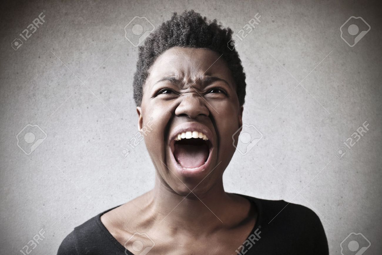 Portrait Black Woman Screaming On Gray Background Stock Photo