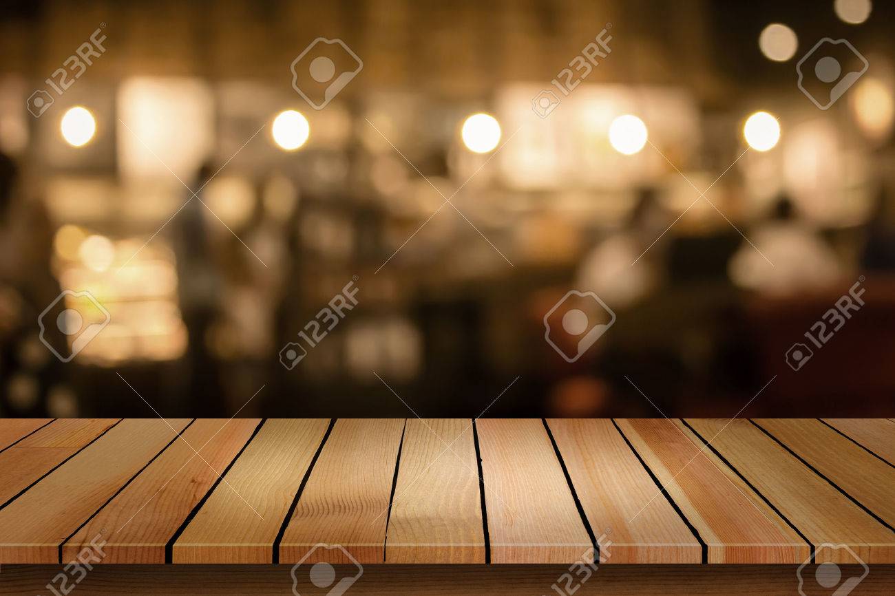 Wood Table Top On Blur Bokeh Cafe Background Can Be Used For