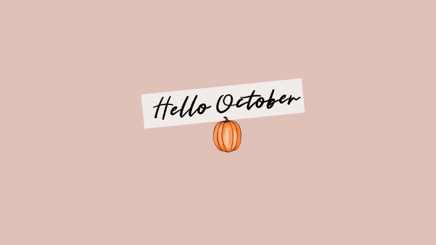 A minimalist Hello October wallpaper with a cute pumpkin illustration and a light pink background